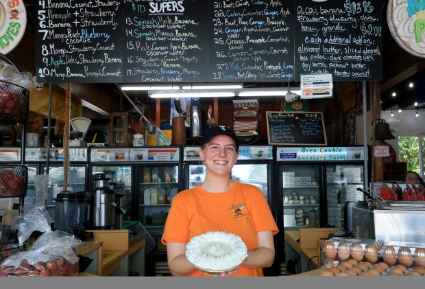 Sam Singer works the juice counter where pies are sold at Bob Roth's New River Groves on Thursday, June 18, 2026. The establishment won the South Florida Sun Sentinel Best of South Florida Dining series for best Key lime pie. (Mike Stocker/South Florida Sun Sentinel)