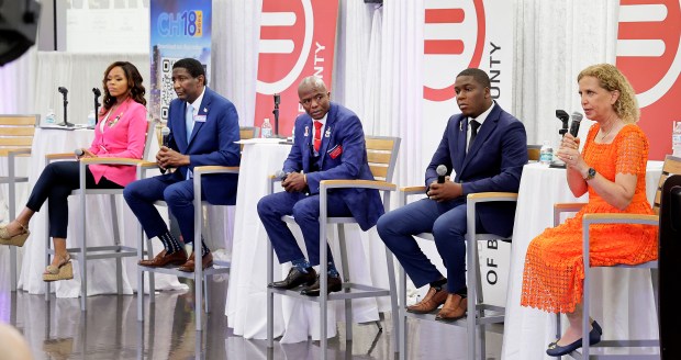 From left, candidates Sheila Cherfilus-McCormick, Dale Holness, Rod Joseph, Elijah Manley and Debbie Wasserman Schultz, speaking at right, during the 20th Congressional District candidate forum at the Urban League of Broward County in Fort Lauderdale on Wednesday, June 17, 2026. Joseph is a Republican, the others are all Democrats. (Carline Jean/South Florida Sun Sentinel)