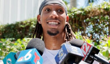 Dolphins' Salyer leaves field on cart; stock up, stock down