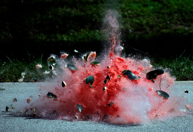 A watermelon is blown apart during a Fort Lauderdale Fire Rescue fireworks safety demonstration Tuesday, at the Fort Lauderdale Executive Airport Fire Station. (Joe Cavaretta/South Florida Sun Sentinel)