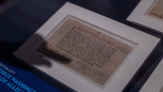 Jesse Katz, historian at the National Archives, points to a George Washington's signature during a press preview of the "Documents that Forged a Nation" exhibit while pointing to a historical document at the Museum of Miami in Miami, Fla., on Wednesday, June 17, 2026. (Marra X. Finkelstein/Miami Herald)