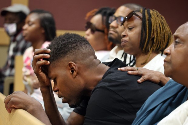 John Carter is comforted in the courtroom during Sean Greer's sentencing hearing at the Broward County Courthouse in Fort Lauderdale on Thursday, June 25, 2026. Carter's then 10 year old son, Johnathan Carter, was injured when Greer plowed into him and five other children as the family was waiting for a bus in Wilton Manors in 2021. (Amy Beth Bennett / South Florida Sun Sentinel)