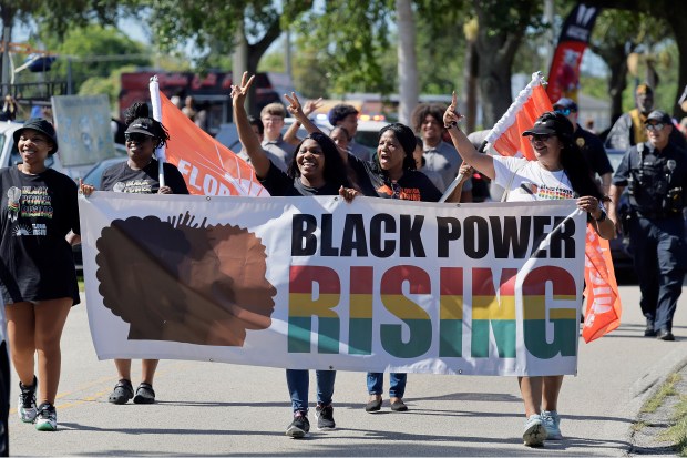 Participants take part in a Juneteenth parade and festival at Washington Park in Hollywood on Thursday, June 19, 2025. The national holiday commemorates the end of slavery. (Mike Stocker/South Florida Sun Sentinel)