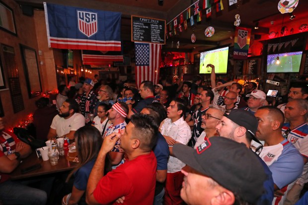 Fans watch the World Cup, group B soccer match between the United States and Wales at Mickey Byrnes Irish Pub on Monday, Nov. 21, 2022 in Hollywood.