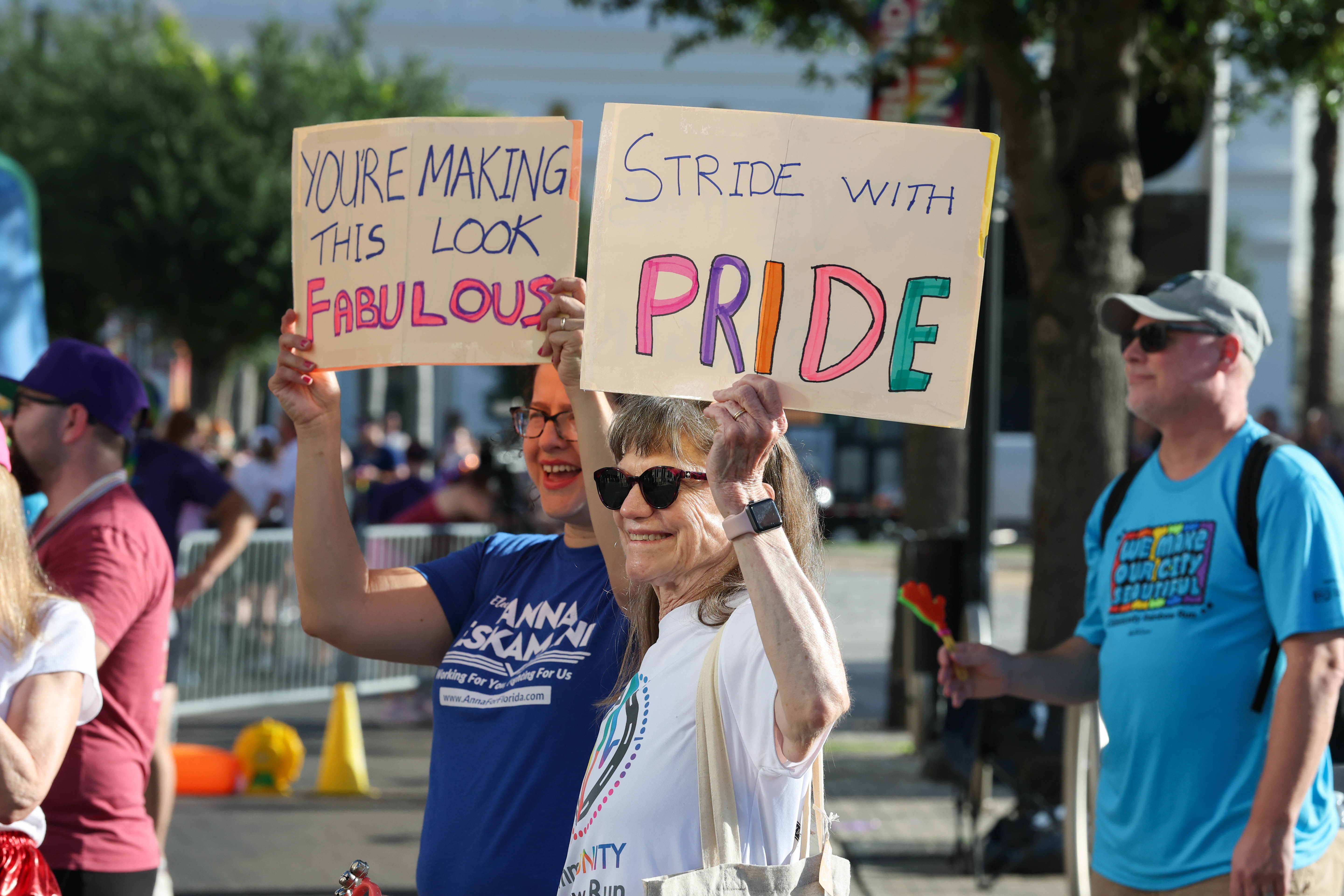 Supporters cheer on the runners during the 10th Annual CommUNITY...