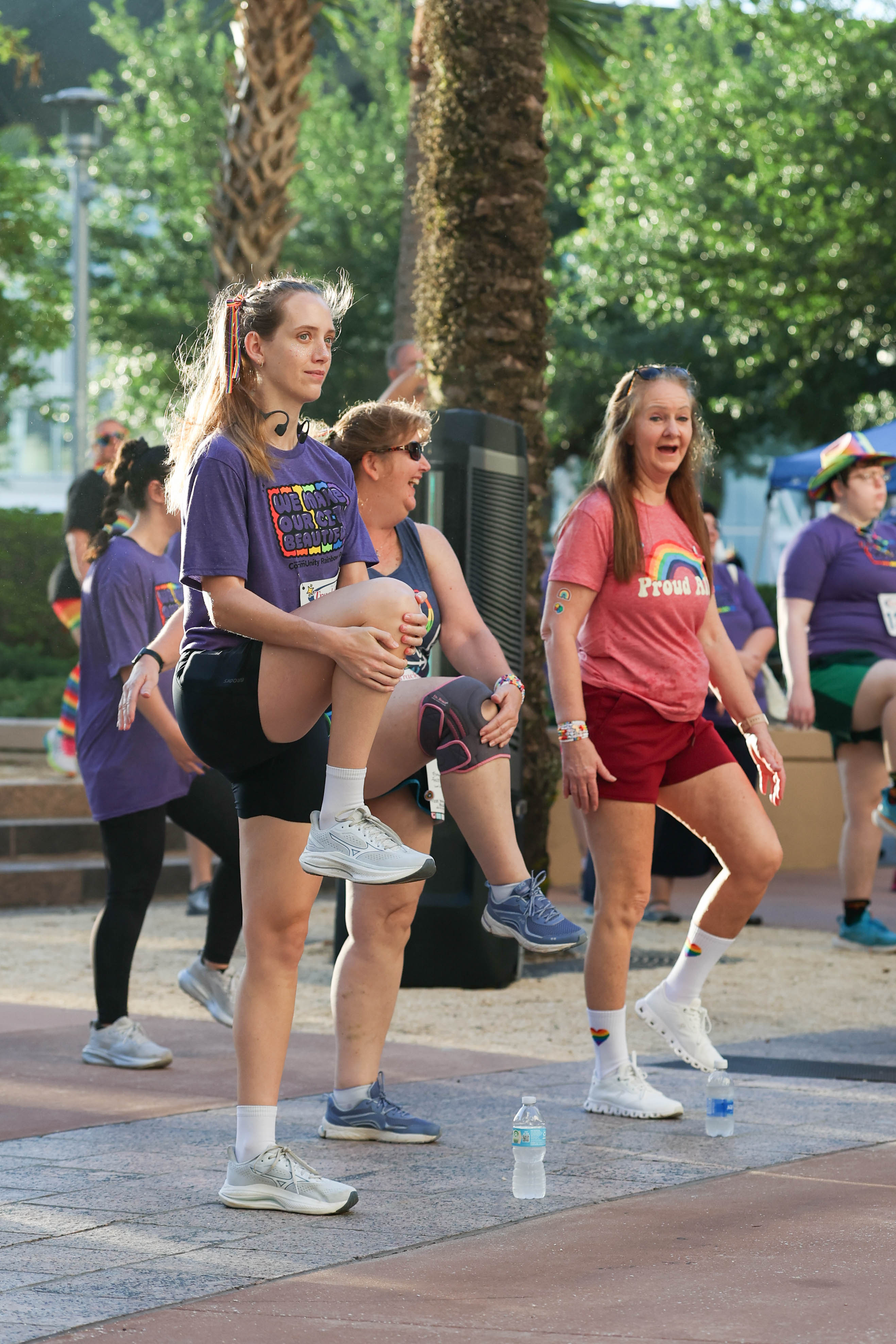 Runners follow a warm-up led by Orlando Health during the...