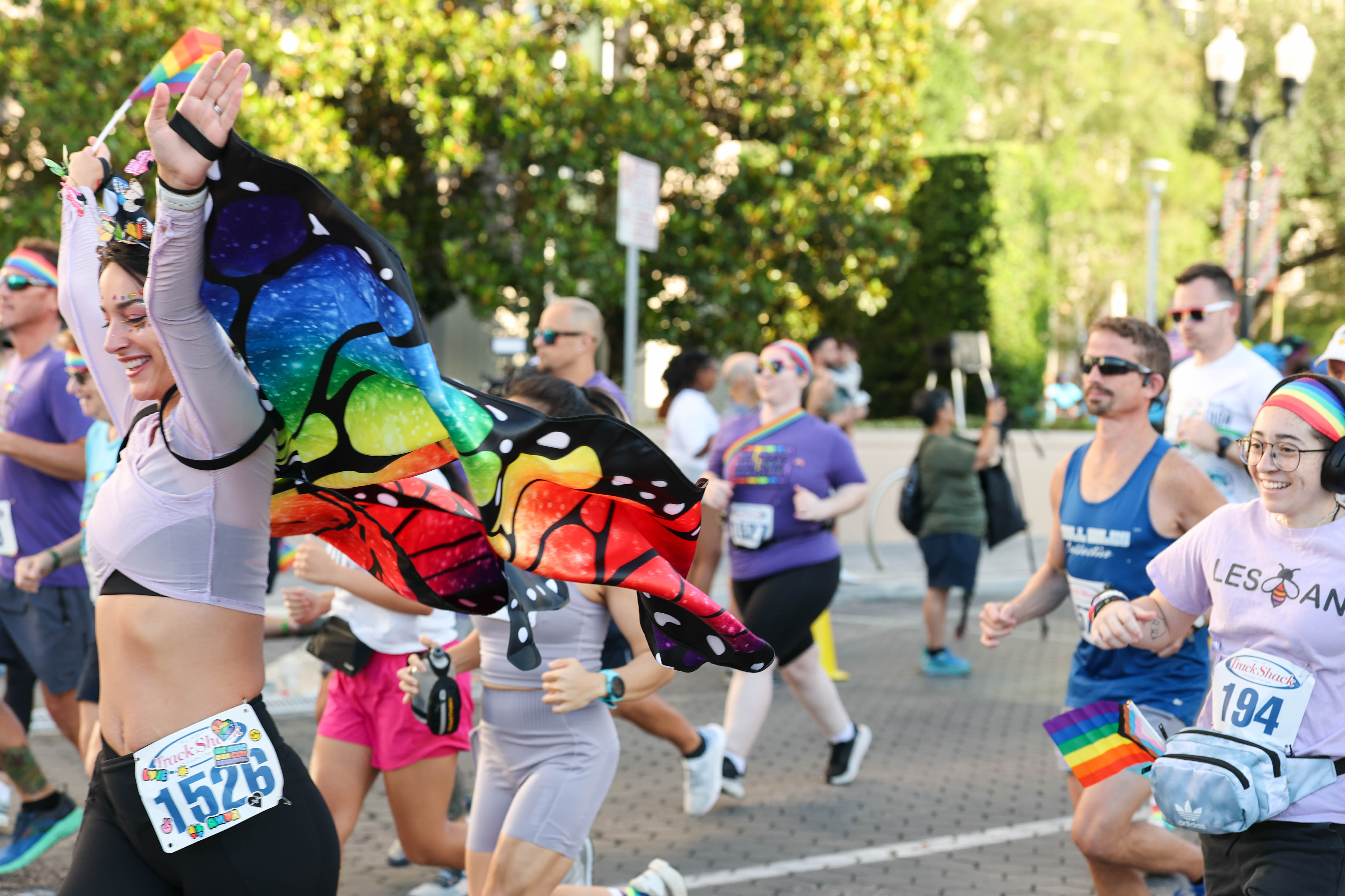 Runner with butterfly wings flies through the start of the...