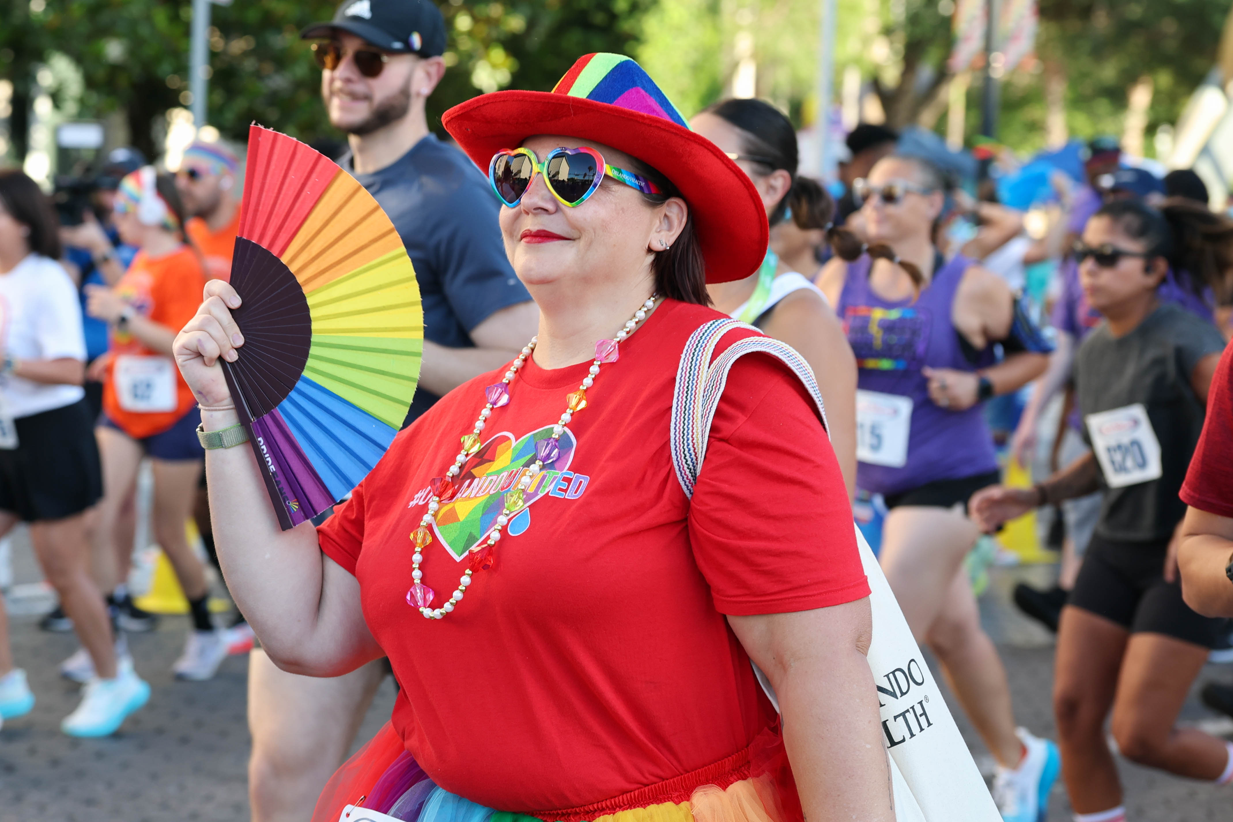 Amanda Ohlson starts the race with her rainbow fan during...