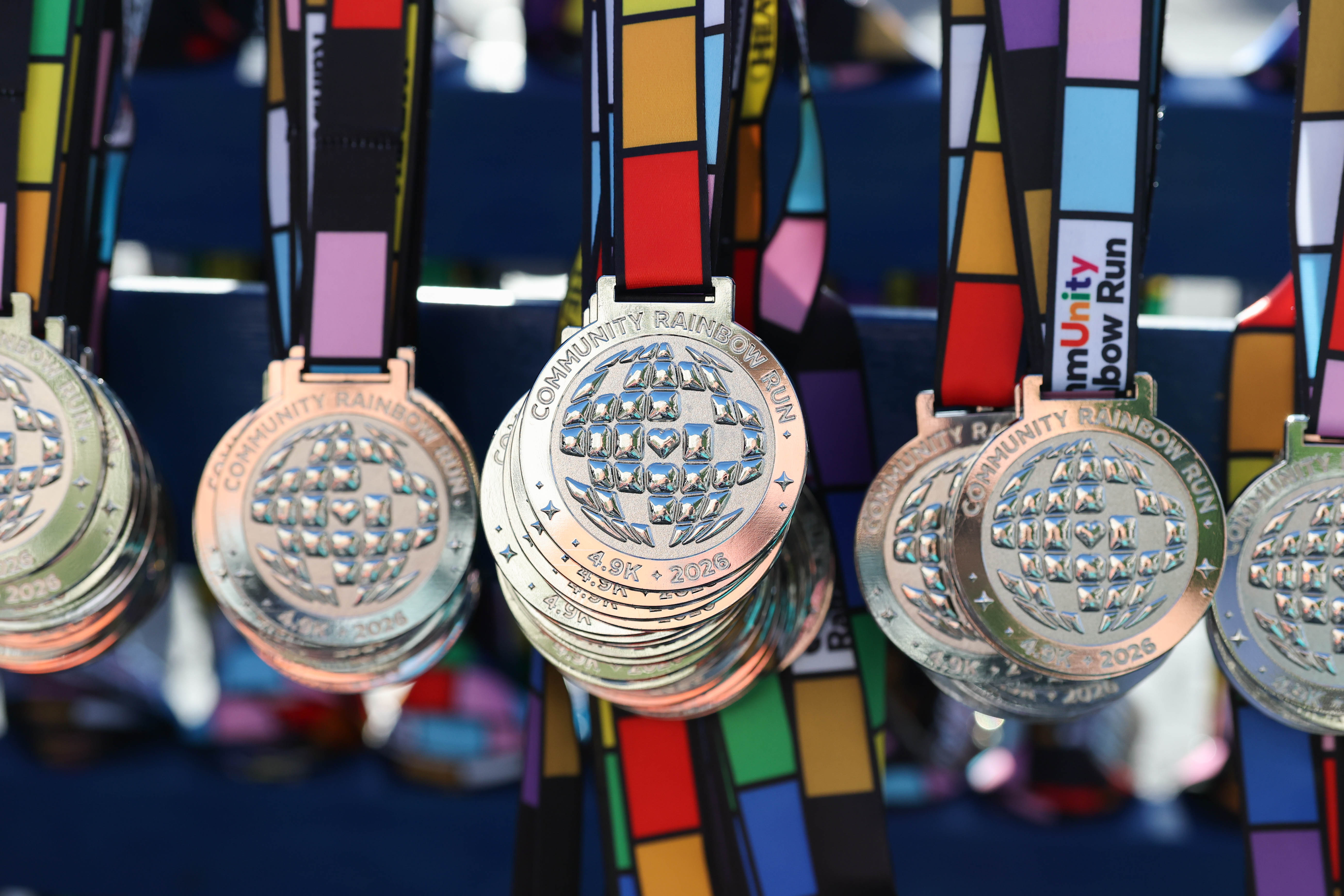 Runner medals for the 10th Annual CommUNITY Rainbow Run at...