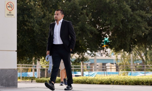 Christopher Delgado walks to the Orlando Federal Courthouse to plead guilty to federal fraud charges, on Tuesday, June 30, 2026. Delgado is the alleged ringleader of a Central Florida cryptocurrency Ponzi scheme who is accused of using other people's money to live a lavish lifestyle. (Ricardo Ramirez Buxeda/ Orlando Sentinel)
