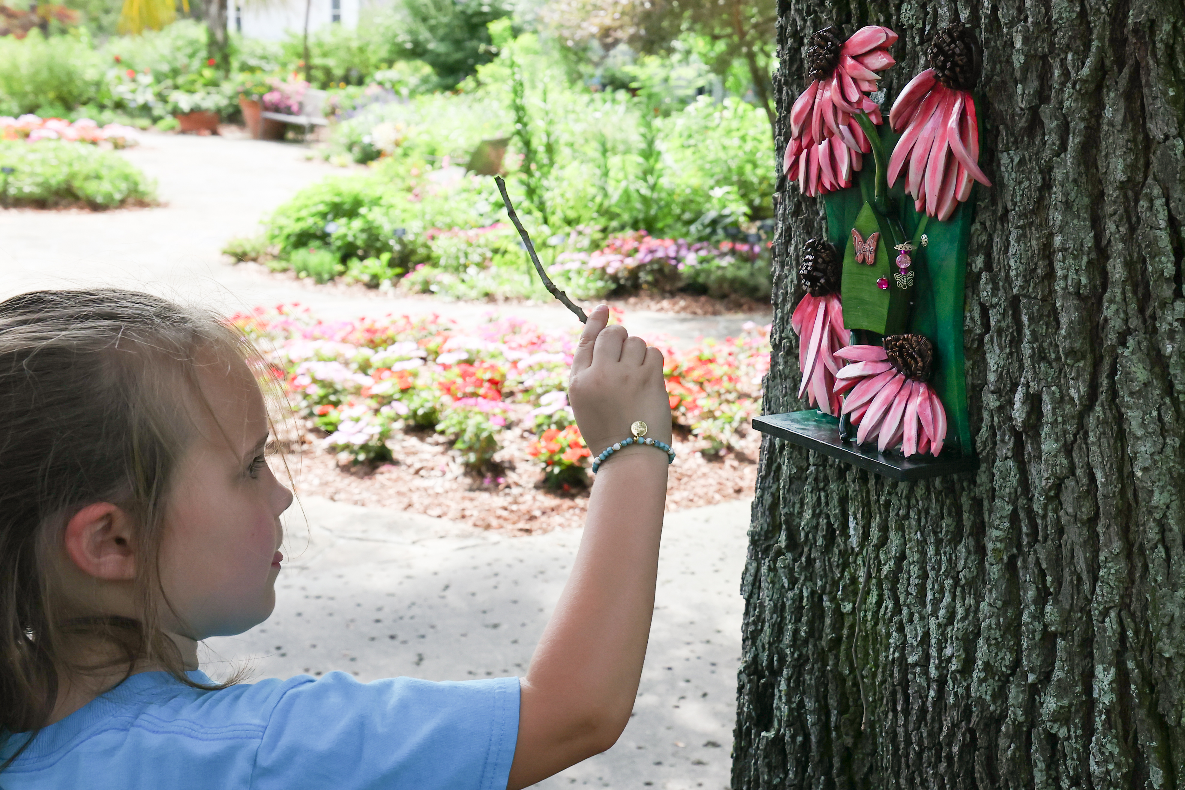 A visitor to the gardens attempts to open Mariposaâs fairy...