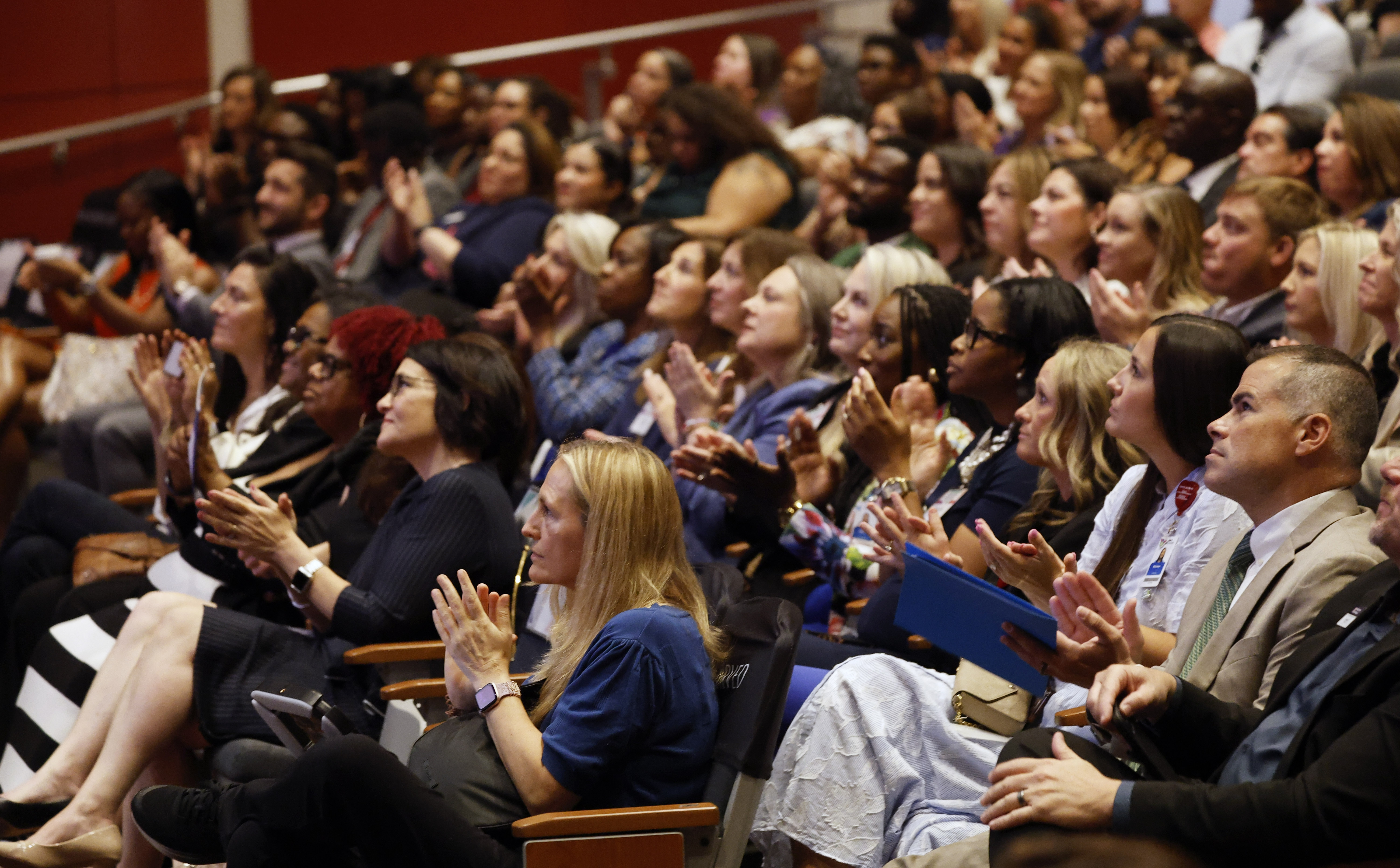 The audience claps during the Orange County Schools 2026 State...