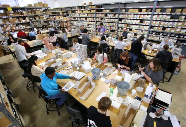 Workers assemble products for shipment in the warehouse of Rifle Paper Co., in Maitland, Monday, October 30, 2017. (Joe Burbank/Orlando Sentinel) 3024564