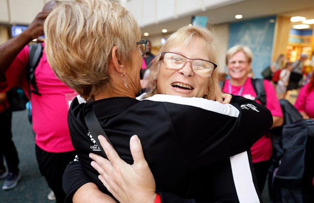 Special Olympics Florida Chief Administrative Officer Berit Amlie hugs Golf athlete Maryann Gonzalez as members of the Special Olympics Team Florida get a sendoff on their way to the USA Games in Minnesota, at the Orlando International Airport, on Friday, June 19, 2026. (Ricardo Ramirez Buxeda/ Orlando Sentinel)