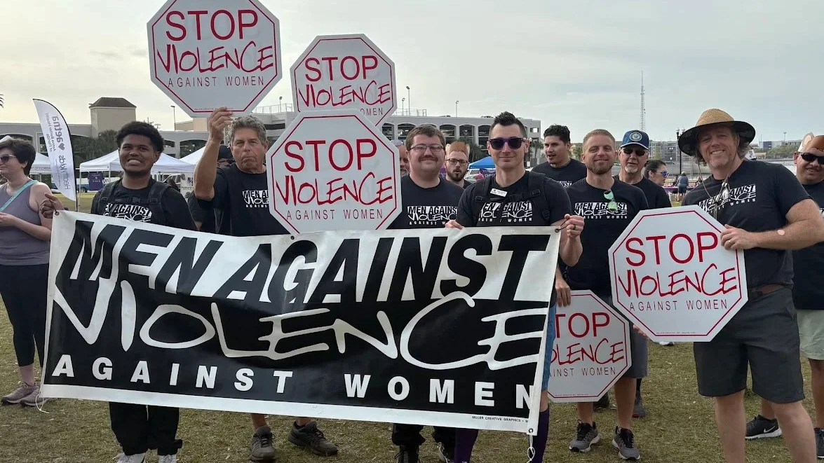 Men march to prevent domestic violence in a photo from Hubbard House