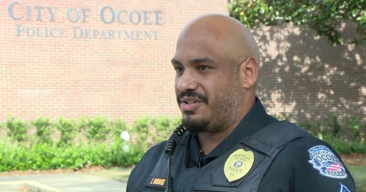 Ocoee police officer rescues woman trapped in overturned vehicle