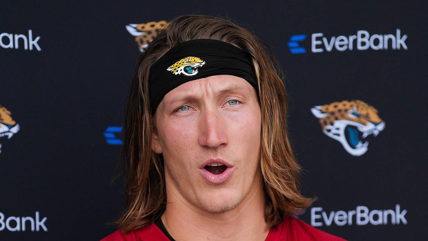 Jacksonville Jaguars quarterback Trevor Lawrence talks with the media