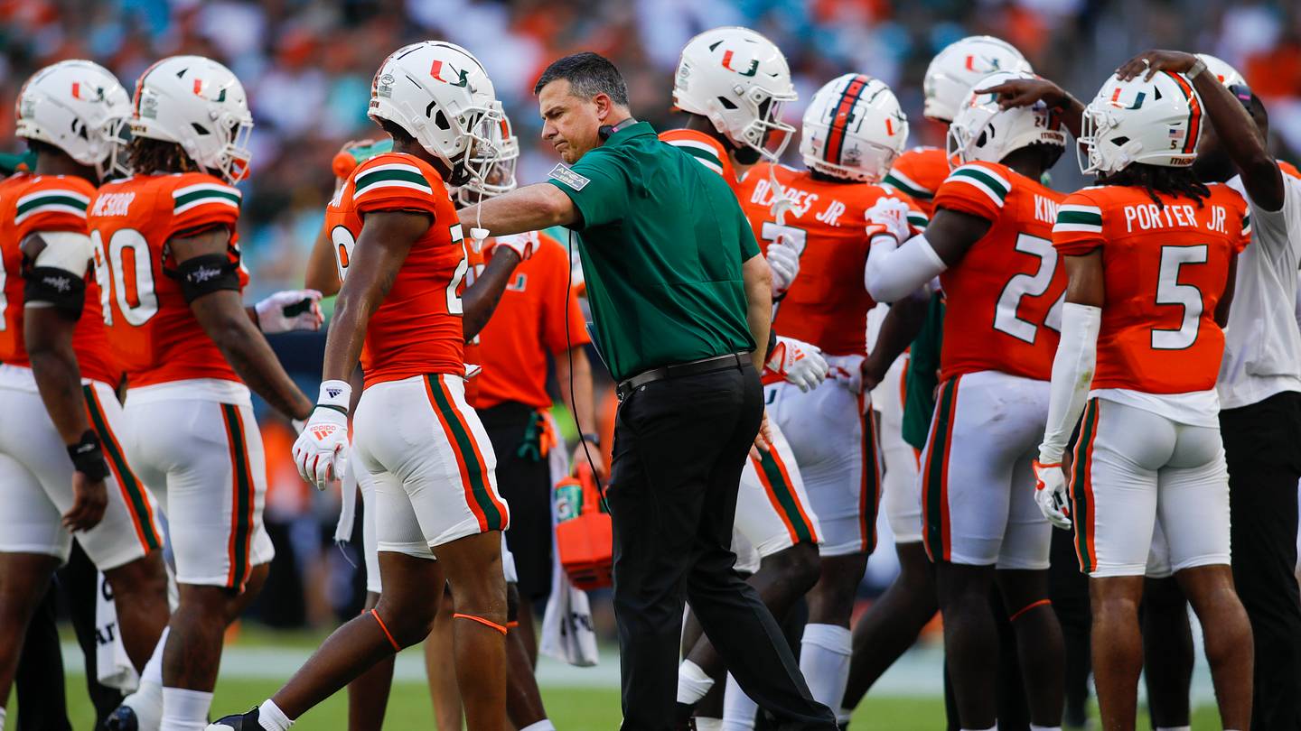 Sep 3, 2022; Miami Gardens, Florida, USA; Miami Hurricanes head coach Mario Cristobal welcomes his players on the sideline during the second quarter against the Bethune Cookman Wildcats at Hard Rock Stadium. Mandatory Credit: Sam Navarro-USA TODAY Sports