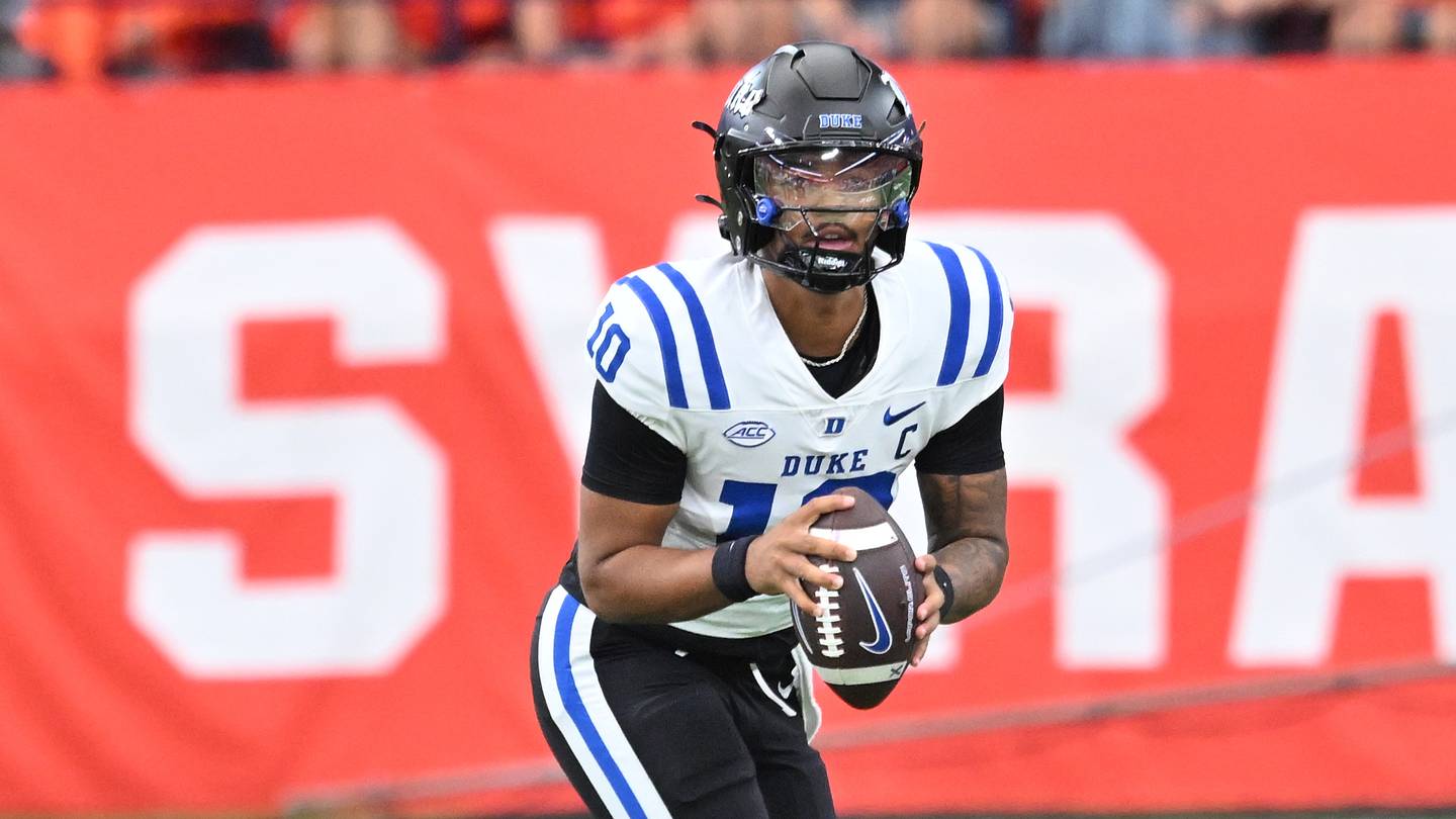 Sep 27, 2025; Syracuse, New York, USA; Duke Blue Devils quarterback Darian Mensah (10) runs out of the pocket in the first quarter against the Syracuse Orange at the JMA Wireless Dome. Mandatory Credit: Mark Konezny-Imagn Images