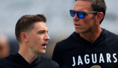 Jacksonville Jaguars General Manager James Gladstone, left, and Tony Boselli, Jacksonville Jaguars Executive Vice President of football operations walk on the field before an NFL football matchup at EverBank Stadium, Sunday, Sept. 21, 2025, in Jacksonville, Fla.