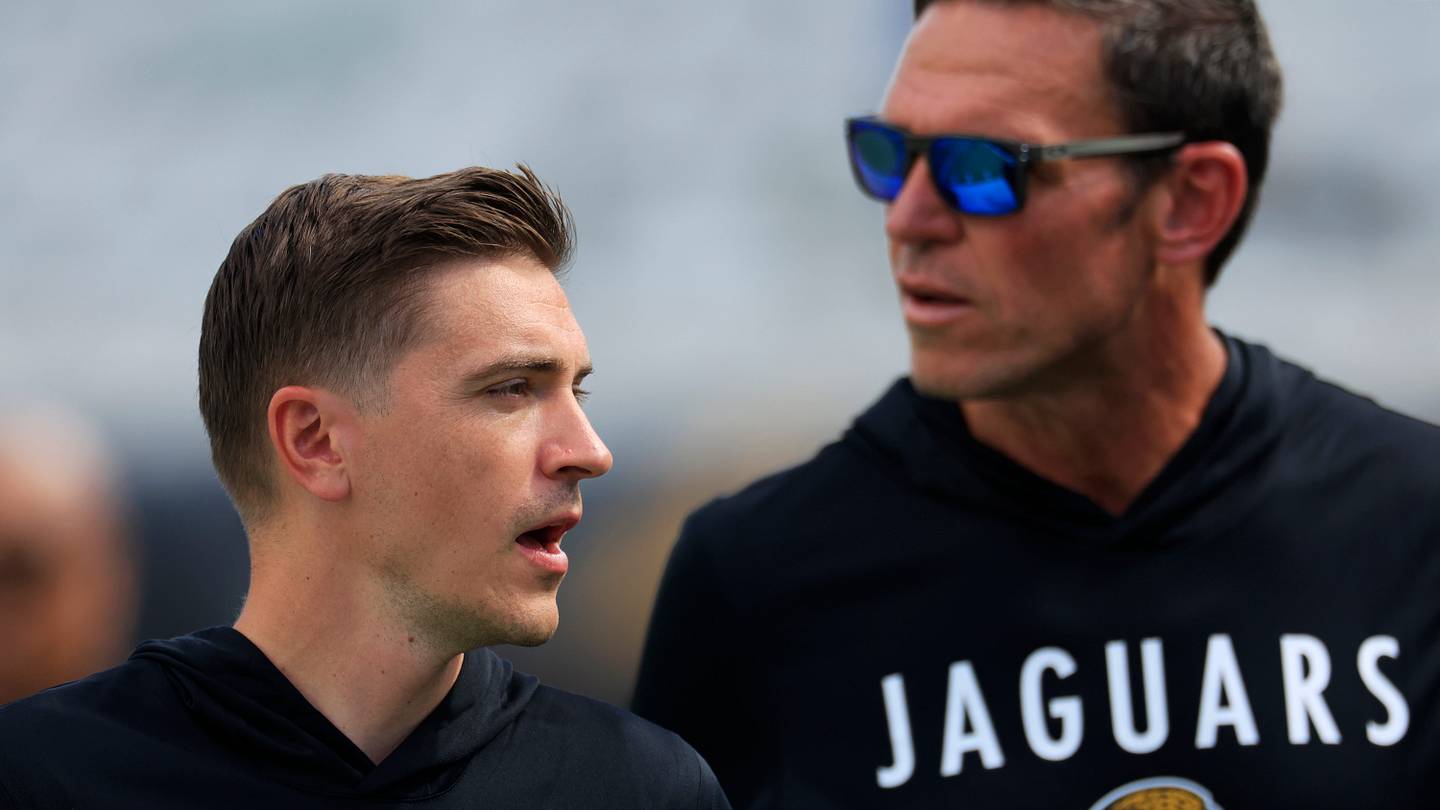 Jacksonville Jaguars General Manager James Gladstone, left, and Tony Boselli, Jacksonville Jaguars Executive Vice President of football operations walk on the field before an NFL football matchup at EverBank Stadium, Sunday, Sept. 21, 2025, in Jacksonville, Fla.