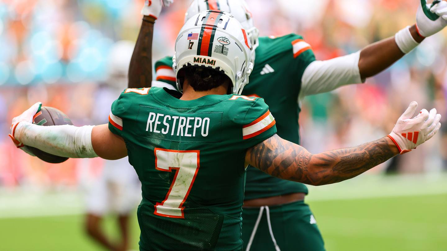 Nov 2, 2024; Miami Gardens, Florida, USA; Miami Hurricanes wide receiver Xavier Restrepo (7) celebrates after scoring a touchdown against the Duke Blue Devils during the fourth quarter at Hard Rock Stadium. Mandatory Credit: Sam Navarro-Imagn Images