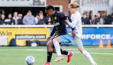 Perrin Barnes holds off Sporting Jacksonville's Rafferty Pedder in the Pittsburgh Riverhounds' 3-2 win on March 28, 2026 at Highmark Stadium in Pittsburgh. (Photo: Chris Cowger/Riverhounds SC)