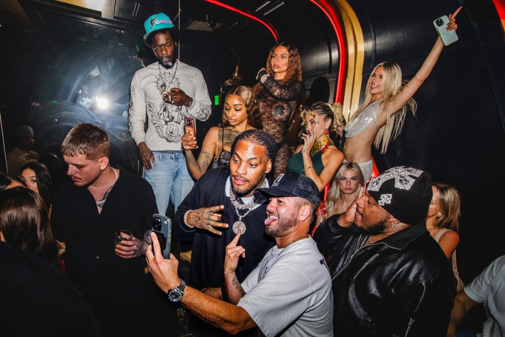 A photo of a group of people inside a nightclub