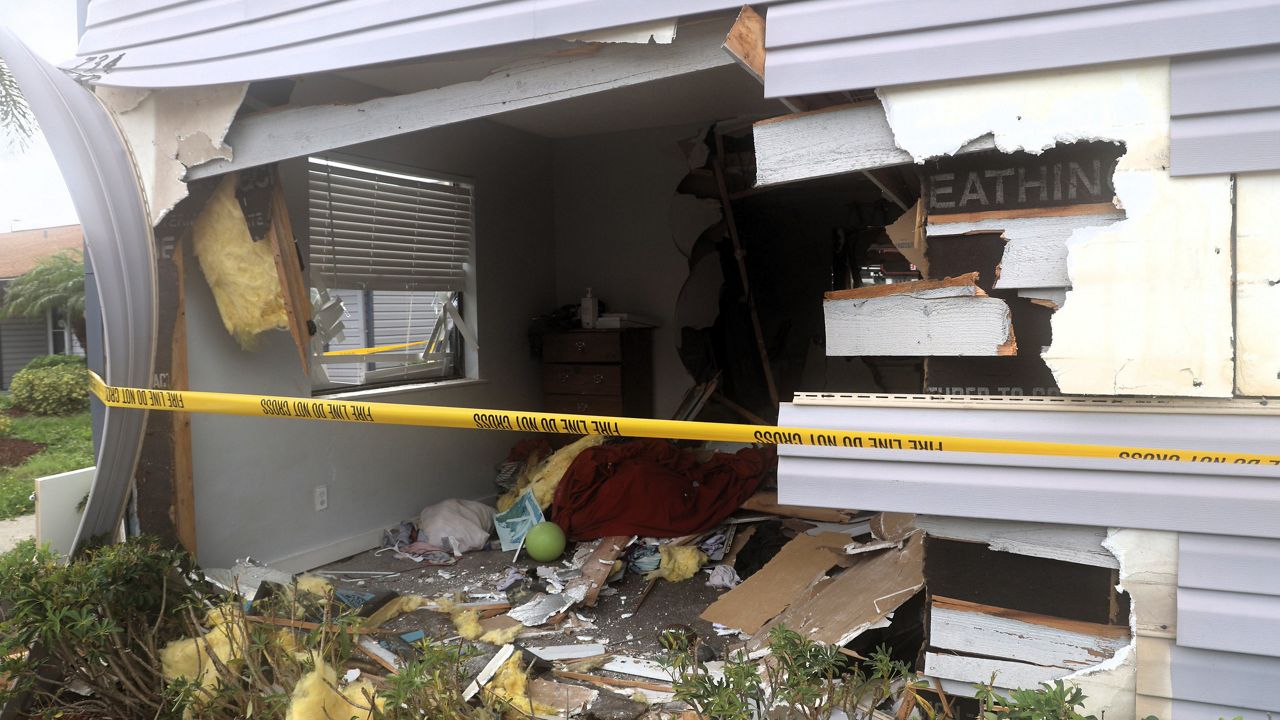 According to the preliminary investigation, the driver backed into one apartment before pulling forward into a second apartment, causing structural damage to both buildings. (Hillsborough County Fire Rescue)