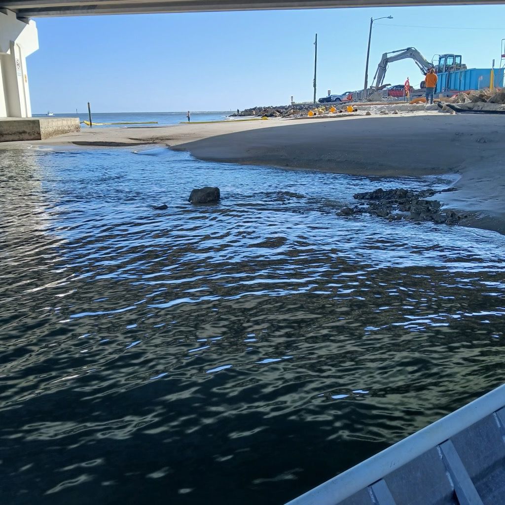 This photo from the City of Madeira Beach was taken from the dredge barge, where you can see debris poking out of the water.