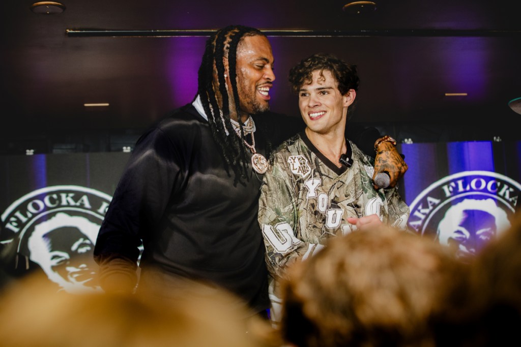 A photo of two men on a stage dancing