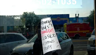A sign on the door of Hamburger Mary's says the restaurant is permanently closed.