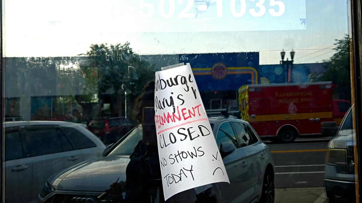 A sign on the door of Hamburger Mary's says the restaurant is permanently closed.