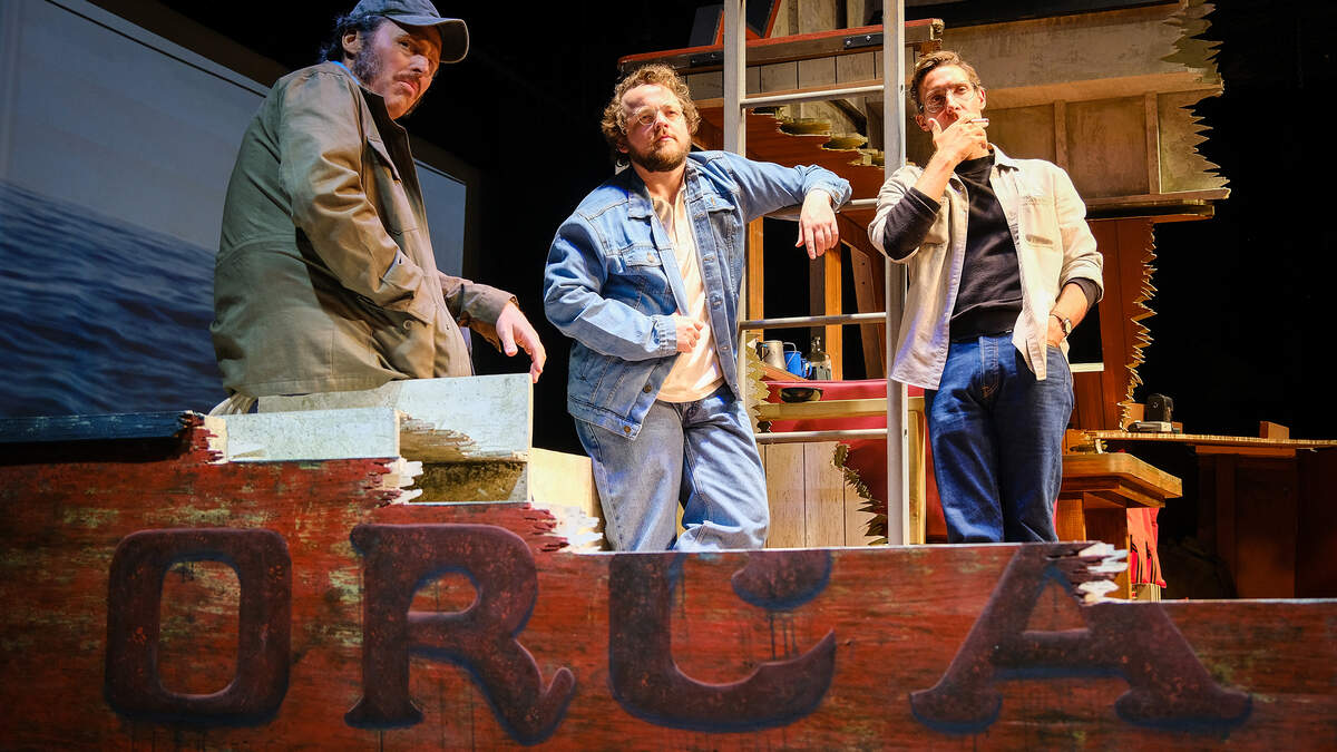 Iain Batchelor (Robert Shaw), Wesley Slade (Richard Dreyfuss) and Adam Poole (Roy Scheider) in “The Shark Is Broken” at Actors’ Playhouse at the Miracle Theatre. Iain Batchelor (Robert Shaw), Wesley Slade (Richard Dreyfuss) and Adam Poole (Roy Scheider) in “The Shark Is Broken” at Actors’ Playhouse at the Miracle Theatre.