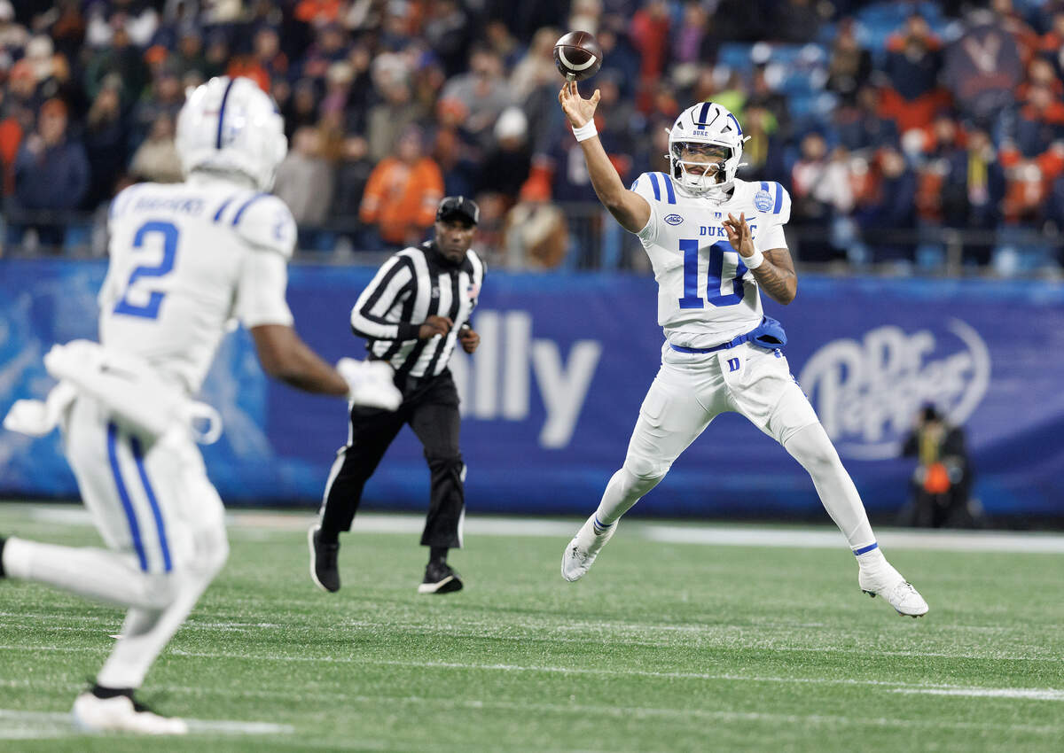 Duke quarterback Darian Mensah looks to throw during the first half of the Blue Devils’ 27-20 overtime win over Virginia in the ACC Football Championship on Saturday, Dec. 6, 2025, at Bank of America Stadium in Charlotte, N.C.