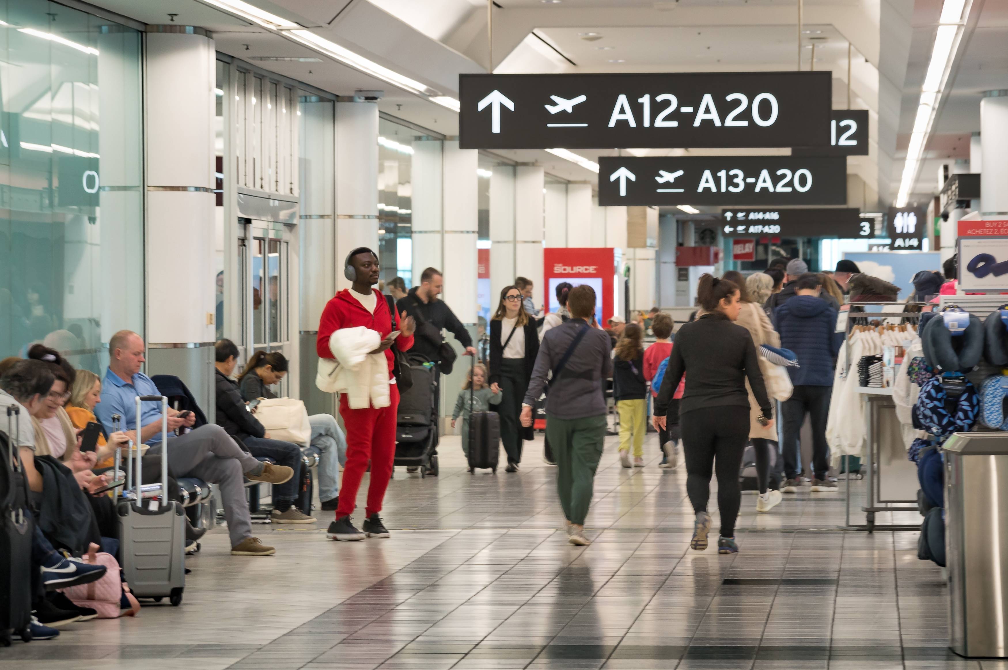 Busy Toronto Pearson International Airport with passengers.