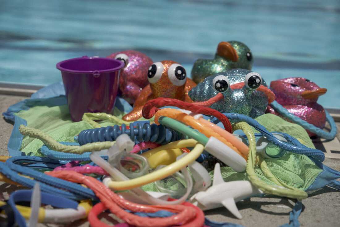 A selection of colorful, sparkly toys are often used for positive reinforcement and redirection in Swim Buddies lessons.