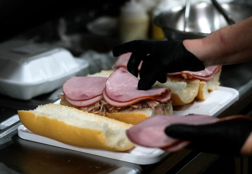 Cubans Be Like restaurant makes a Miami-style cuban sandwich with Cuban bread, roasted pork, Serrano ham, pickles and mustard.