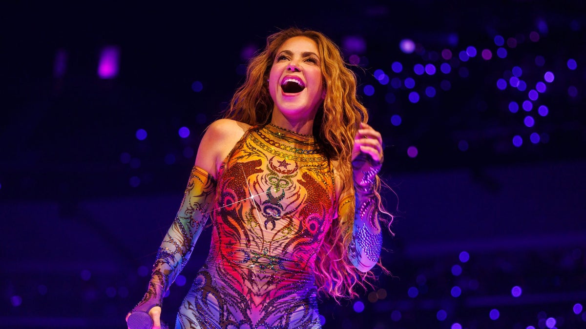 Shakira shines in a red fringed bikini as she soaks up the Miami sun