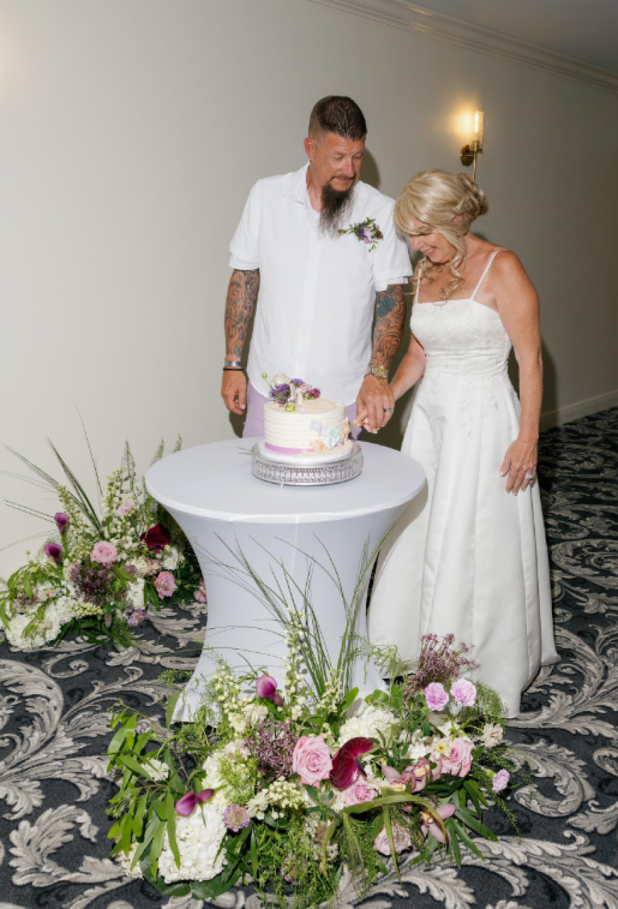 Abby and Josh Killion cut their wedding cake during their vow renewal ceremony at Sundial Beach Resort & Spa on June 16, 2026.