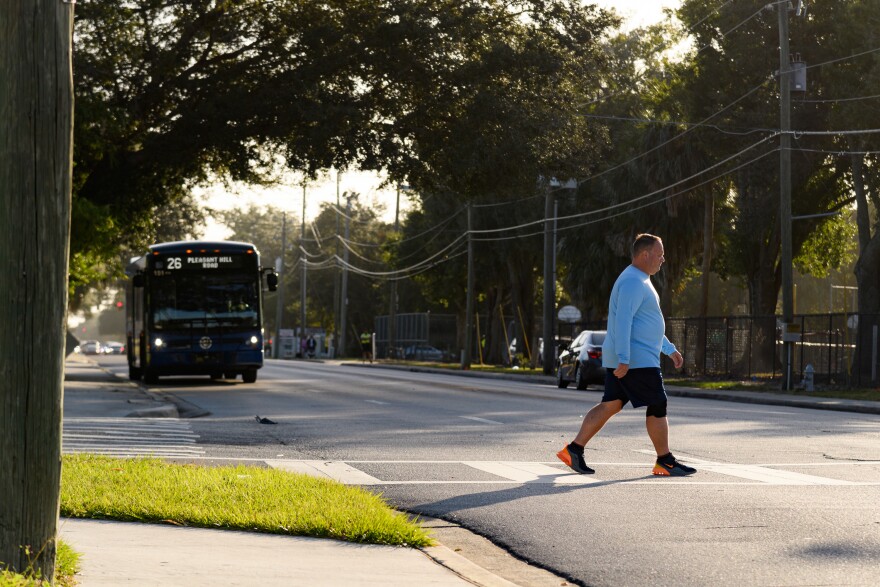 People cross an intersection in Kissimmee to track driver yield rates during a “Best Foot Forward” operation in 2023.