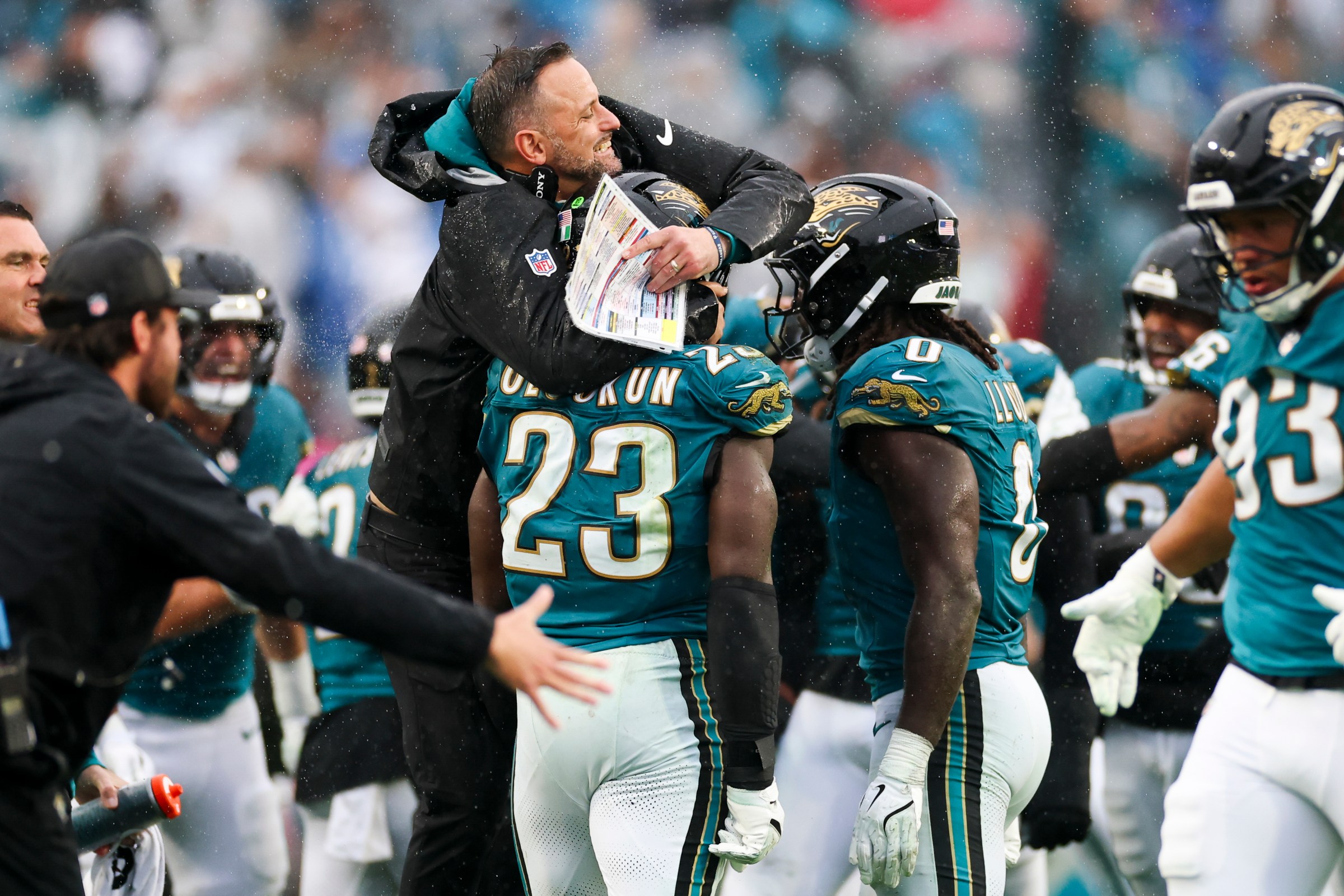 JACKSONVILLE, FLORIDA - DECEMBER 7: Defensive coordinator Anthony Campanile and Foyesade Oluokun #23 of the Jacksonville Jaguars celebrate during an NFL 2025 game against the Indianapolis Colts at Everbank Stadium on December 7, 2025 in Jacksonville, Florida. (Photo by Logan Bowles/Getty Images)