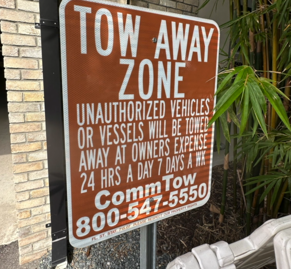 Sign posted outside garage when Adair's SUV was towed