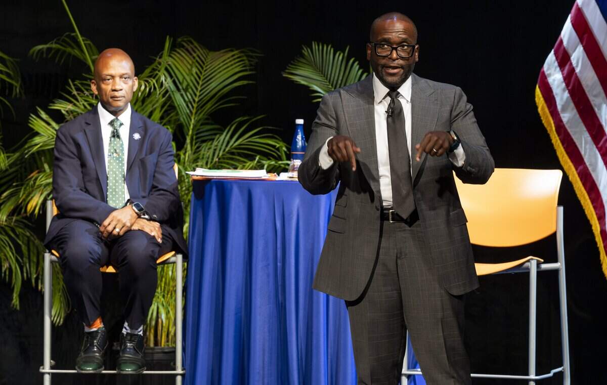 Miami-Dade commissioner Oliver Gilbert, left, listens to Florida State Senator Shevrin Jones speak during a town hall debate ahead of the U.S. House Florida District 24 race at Florida Memorial University on Tuesday, June 30, 2026, in Miami Gardens, Fla.