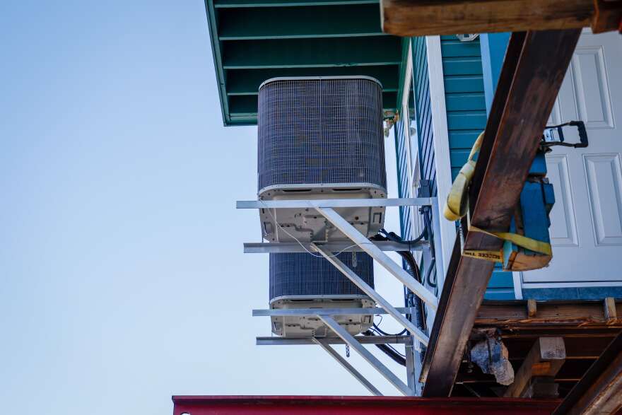 A close up of the support beams being used to elevate a house.