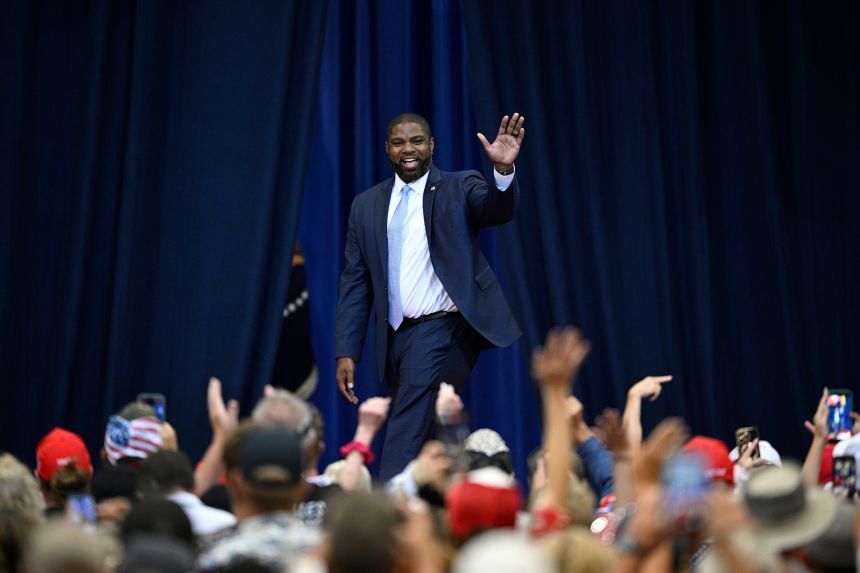 Rep. Byron Donalds acknowledges attendees before a visit by President Donald Trump in The Villages, Florida, on May 1.