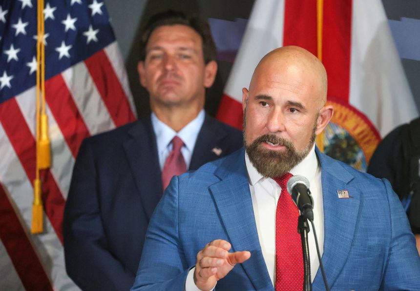 Florida Lt. Gov. Jay Collins delivers remarks, as Gov. Ron DeSantis listens, during a news conference at the FDLE Orlando Regional Operations Center in Orlando, Florida, in September 2, 2025.