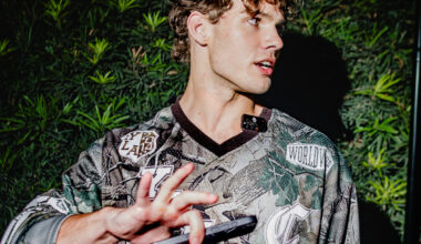 A young man puts his hand in front of a camera