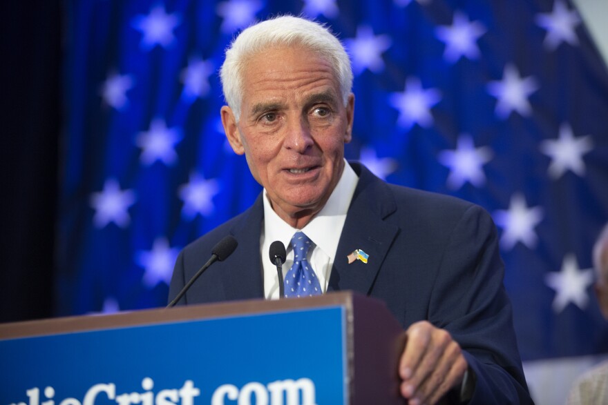 Charlie Crist speaking at the podium