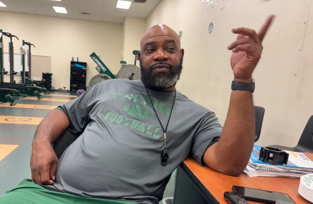 Weather pushed the Evans High football team indoors Monday, the first day of football practice, so head coach Karlos Odum spoke to the Sentinel in the weight room. (Chris Hays/Orlando Sentinel)